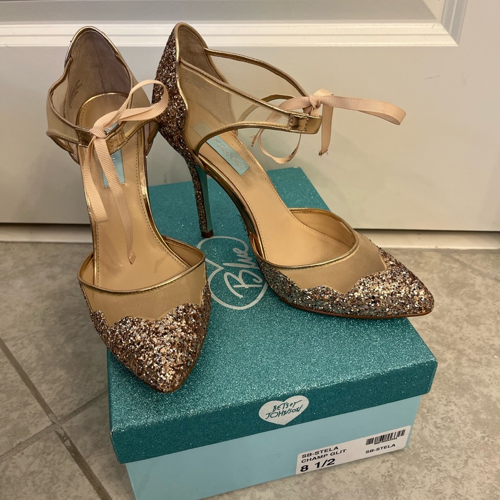 Only worn once, champagne colored heels.